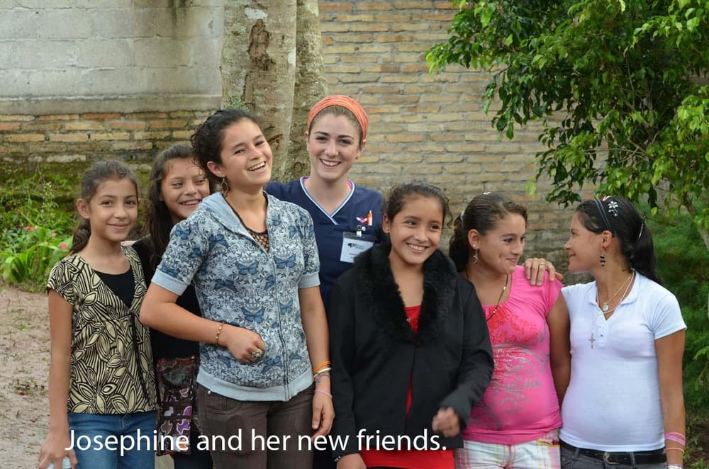 A dental assistant with a group of patients during a Honduras Mission trip