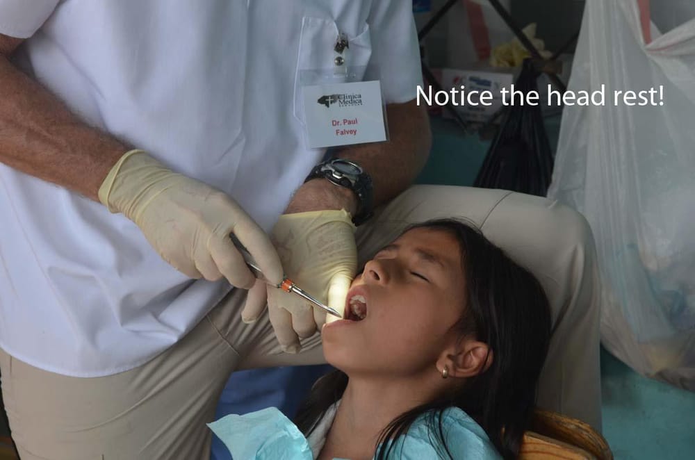 Dr. Falvey working with a patient during a Honduras Mission trip