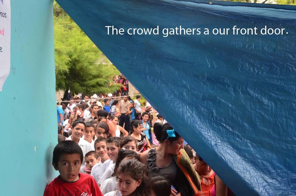 A crowd gathering in front of the dental clinic