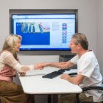 Dr. Falvey shaking hands with a patient