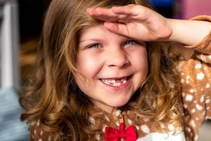 little girl with missing teeth